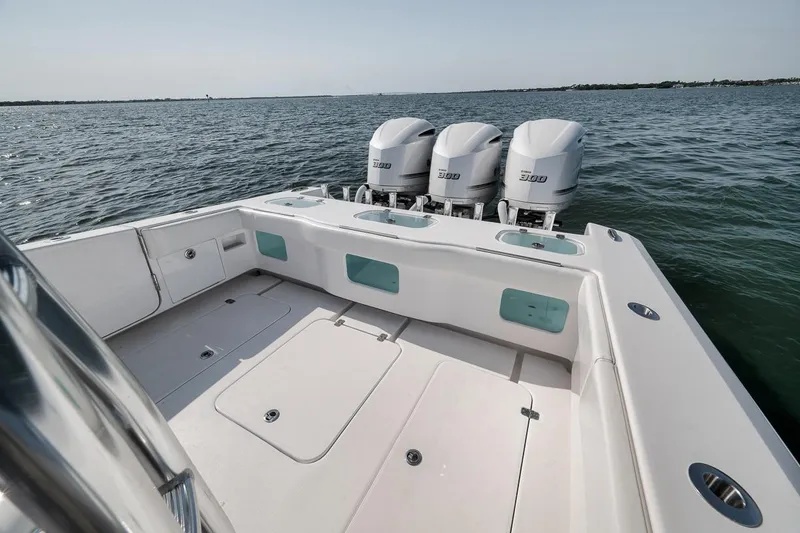 Slide: The Image of 2025 Marquesa 34 boat with triple engines on open water. - 66