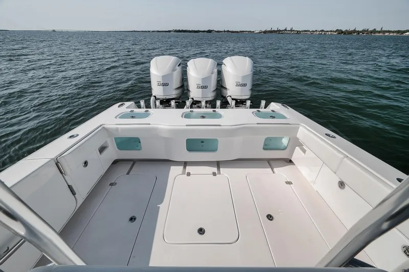 Slide: The Image of 2025 Marquesa 34 boat with triple engines on open water. - 67