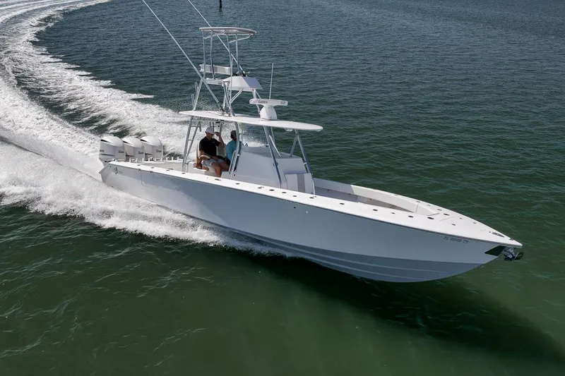 Slide: The Image of A sleek 2025 Marquesa 34 boat cruising swiftly on open water. - 7