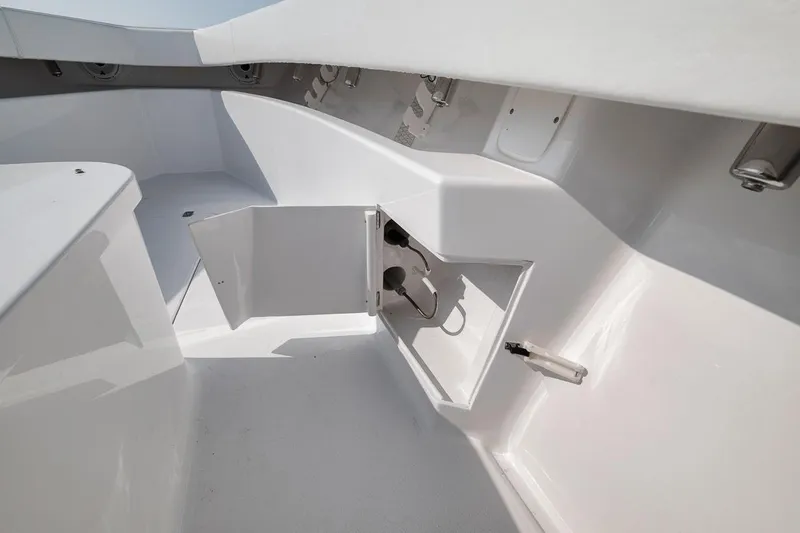 Slide: The Image of Interior view of 2025 Marquesa 34 boat, featuring sleek white storage compartment. - 72