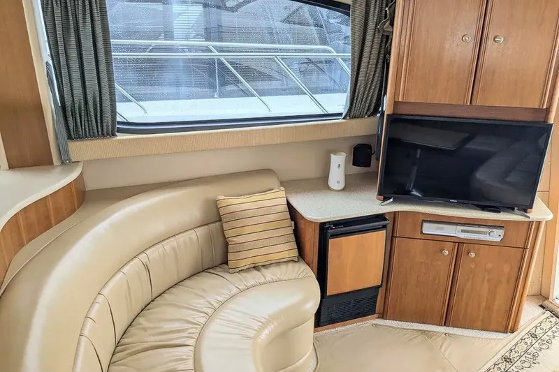 Slide: The Image of Interior of a 2004 Meridian 411 Sedan yacht with sofa and TV. - 18
