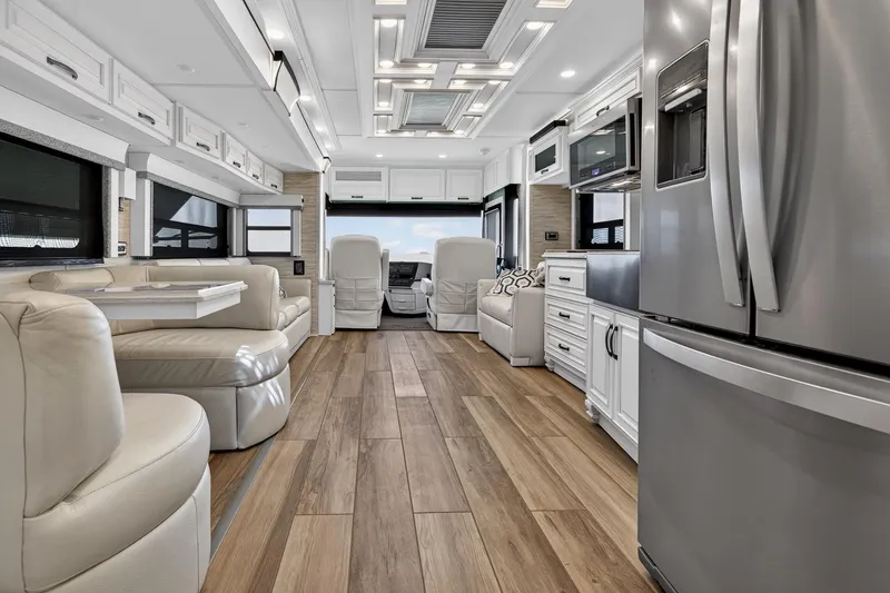 Slide: The Image of Luxurious interior of 2025 Newmar Dutch Star 4340 RV with modern kitchen and seating. - 15