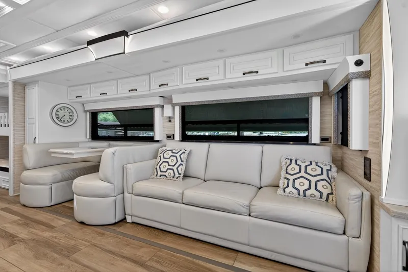 Slide: The Image of Luxurious interior of 2025 Newmar Dutch Star 4340 RV with modern seating and decor. - 16