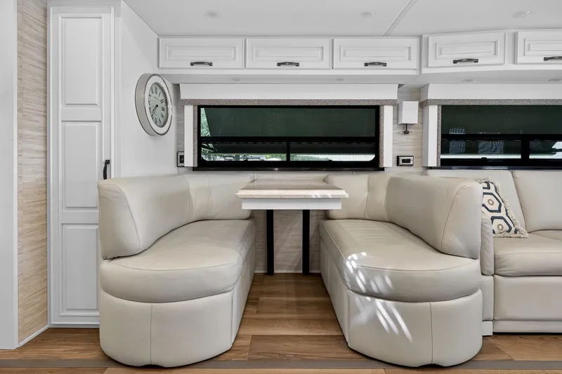 Slide: The Image of 2025 Newmar Dutch Star 4340 interior with elegant leather seating and modern decor. - 17