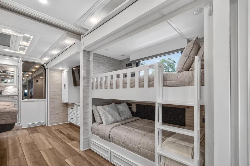 Slide: The Image of 2025 Newmar Dutch Star 4340 interior with bunk beds and modern design. - 18