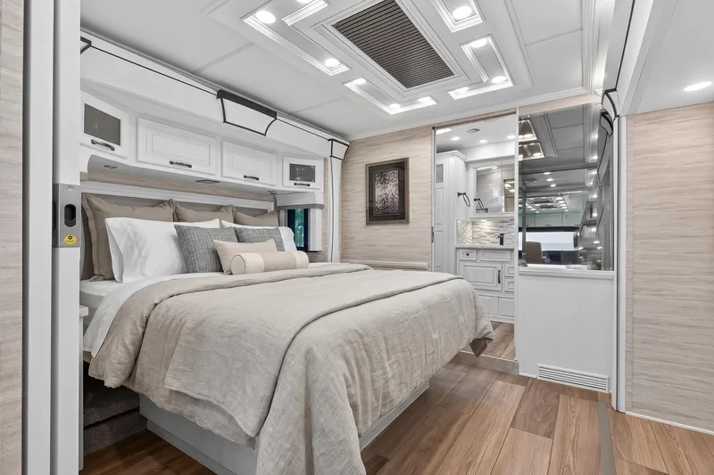 Slide: The Image of Luxurious bedroom interior of 2025 Newmar Dutch Star 4340 RV with elegant decor and modern amenities. - 24