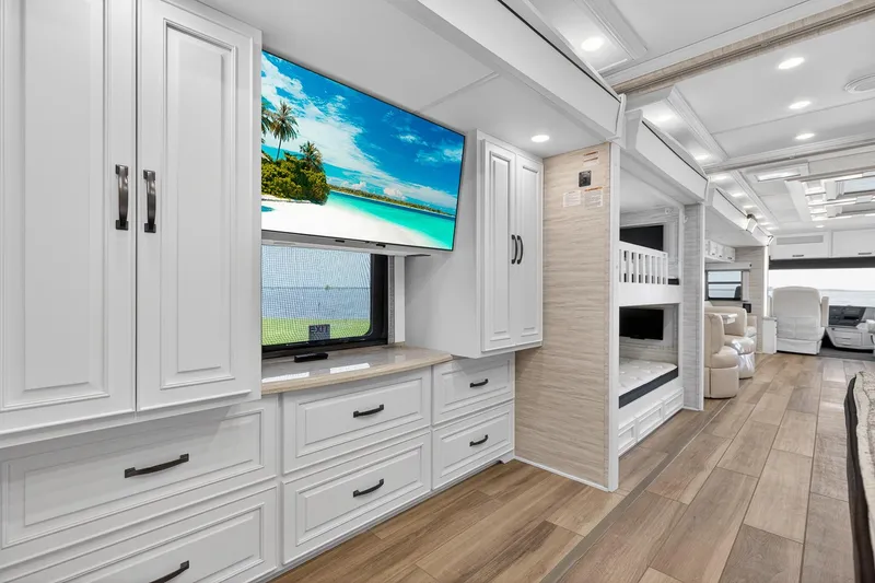 Slide: The Image of Luxurious interior of 2025 Newmar Dutch Star 4340 RV with modern cabinetry and entertainment system. - 27