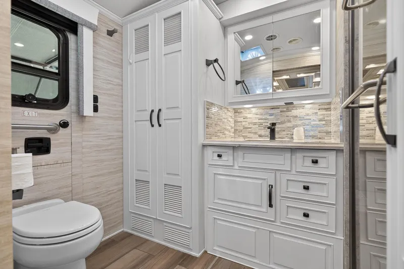 Slide: The Image of Luxurious bathroom in 2025 Newmar Dutch Star 4340 RV with modern fixtures and elegant cabinetry. - 29