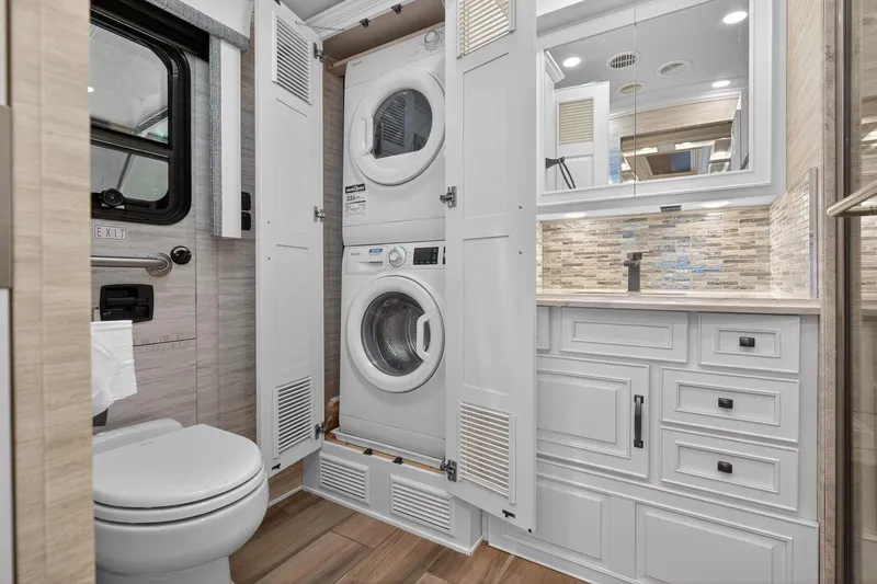 Slide: The Image of Luxurious 2025 Newmar Dutch Star 4340 RV bathroom with washer, dryer, and elegant cabinetry. - 30