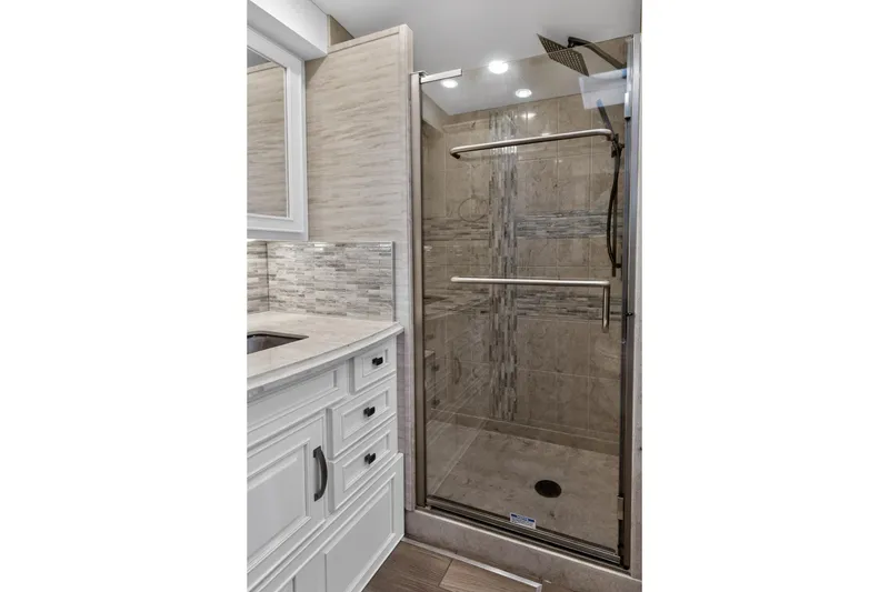 Slide: The Image of Luxurious bathroom in 2025 Newmar Dutch Star 4340 RV with modern shower and elegant vanity. - 31