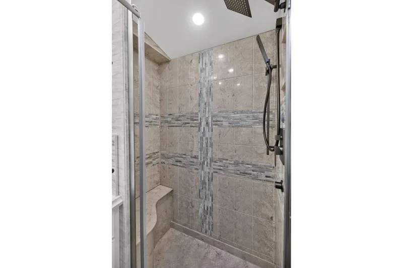 Slide: The Image of Luxurious shower interior in 2025 Newmar Dutch Star 4340 RV, featuring elegant tile design. - 32