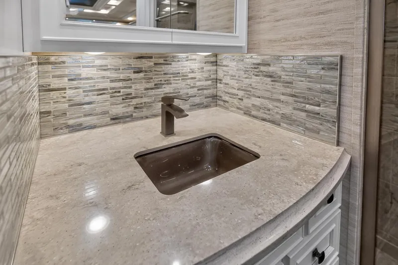 Slide: The Image of 2025 Newmar Dutch Star 4340 RV bathroom sink with modern faucet and stylish backsplash. - 33