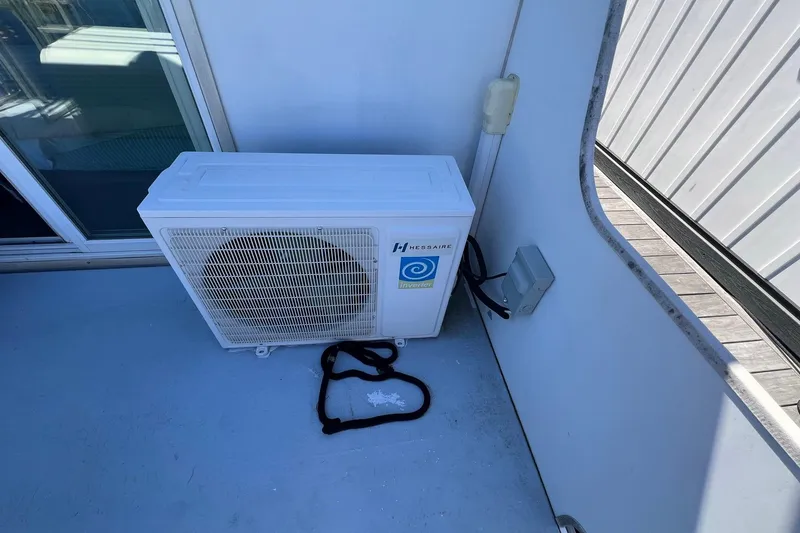 Slide: The Image of Outdoor air conditioning unit on 2019 Catamaran Cruisers houseboat deck. - 16