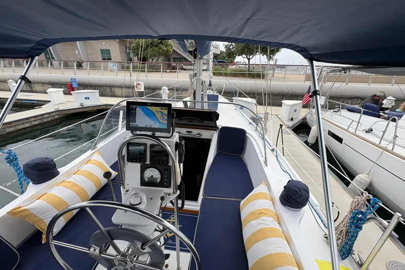 Slide: The Image of 1972 Coronado Yachts 35 Center Cockpit sailboat with navigation equipment, docked at marina. - 10