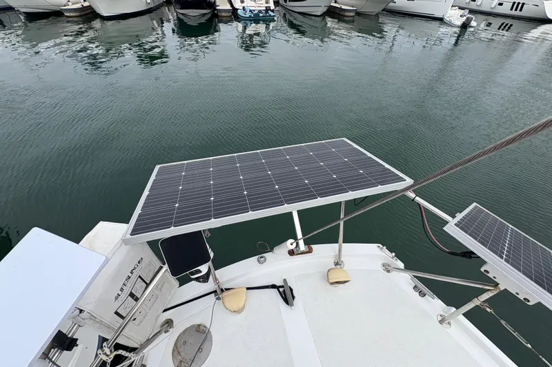 Slide: The Image of Solar panels on a 1972 Coronado Yachts 35 Center Cockpit, docked at a marina. - 13