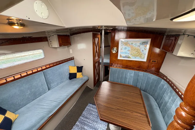 Slide: The Image of Interior of 1972 Coronado Yachts 35 Center Cockpit with cozy seating and nautical decor. - 16