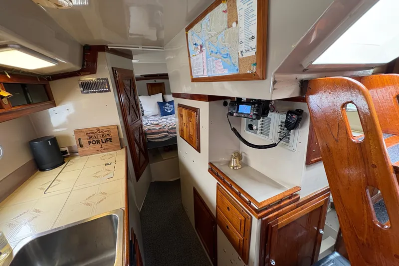 Slide: The Image of Interior of a 1972 Coronado Yachts 35 Center Cockpit with wood accents and navigation equipment. - 20