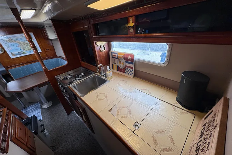 Slide: The Image of Interior of 1972 Coronado Yachts 35 Center Cockpit with kitchen and dining area. - 22