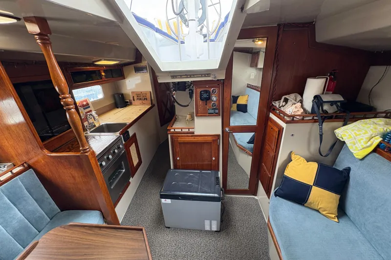 Slide: The Image of Interior of 1972 Coronado Yachts 35 Center Cockpit with cozy seating and kitchen area. - 24