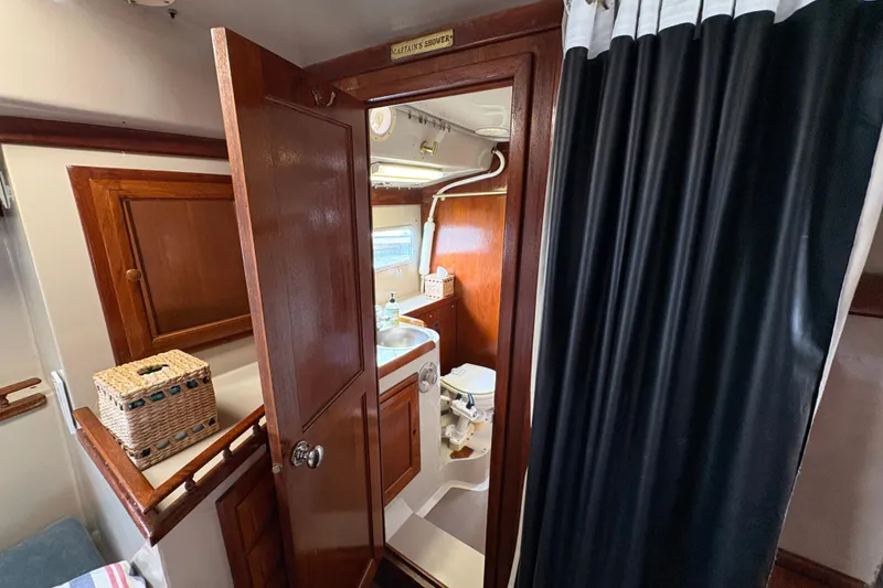 Slide: The Image of Interior of 1972 Coronado Yachts 35 Center Cockpit, featuring a compact bathroom. - 25