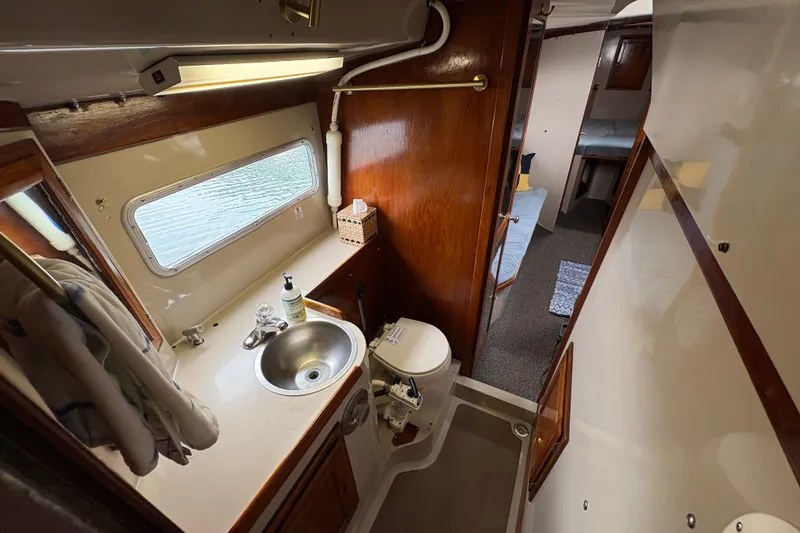 Slide: The Image of Interior of 1972 Coronado Yachts 35 Center Cockpit with bathroom and cabin view. - 27