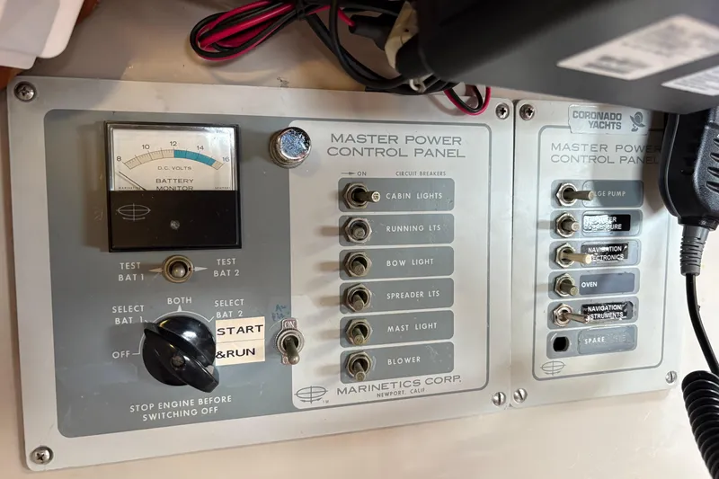 Slide: The Image of Master power control panel of 1972 Coronado Yachts 35 Center Cockpit with switches and battery monitor. - 30