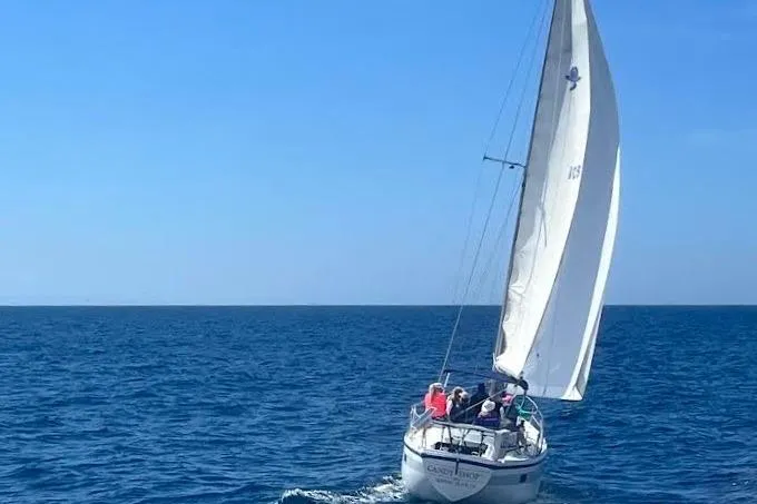 Slide: The Image of 1972 Coronado Yachts 35 Center Cockpit sailing on open sea under clear blue sky. - 4
