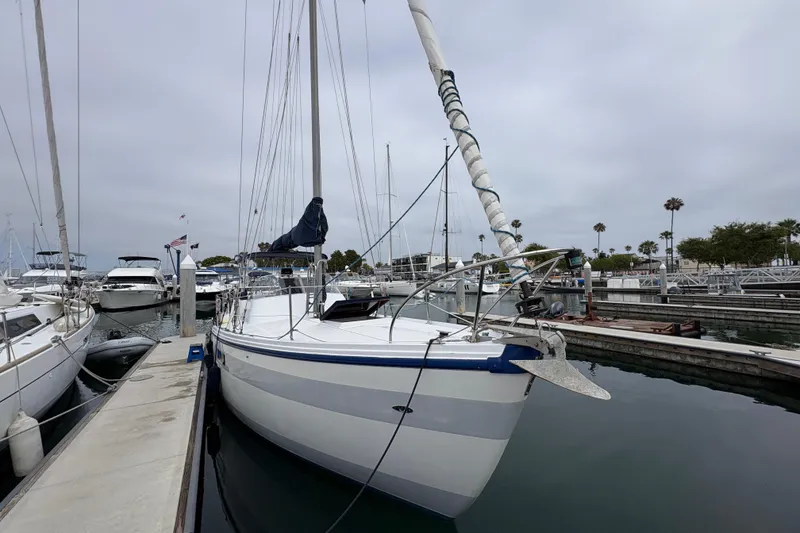 Slide: The Image of 1972 Coronado Yachts 35 Center Cockpit sailboat docked in a marina. - 6