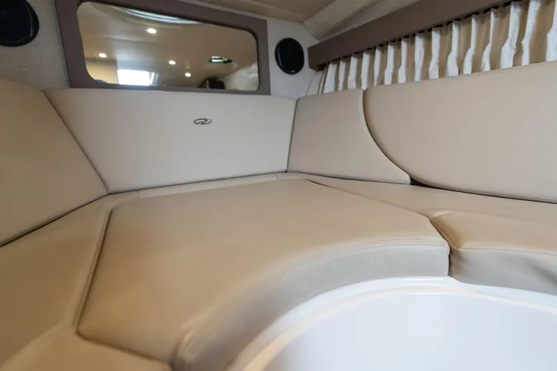 Slide: The Image of Interior of 2016 Regal 28 Express boat with beige seating and modern design. - 10