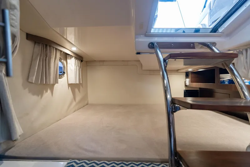 Slide: The Image of Interior cabin of 2016 Regal 28 Express boat with stairs and window. - 20