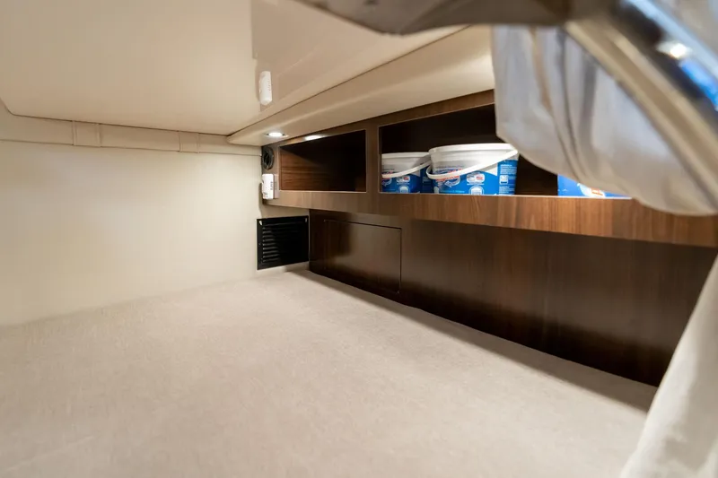 Slide: The Image of Interior cabin storage of 2016 Regal 28 Express boat with shelves and lighting. - 21