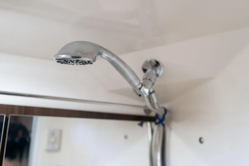 Slide: The Image of Showerhead in 2016 Regal 28 Express boat interior, chrome finish, modern design. - 24