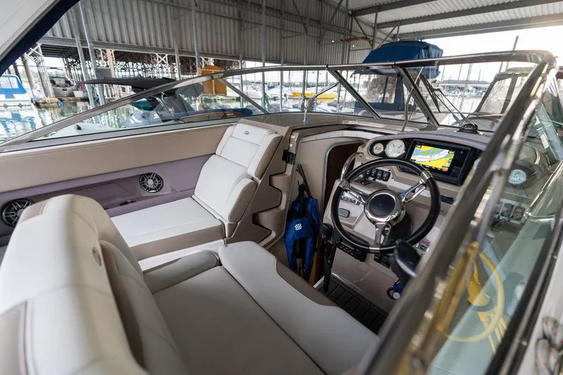 Slide: The Image of Interior of 2016 Regal 28 Express boat with modern dashboard and seating. - 28