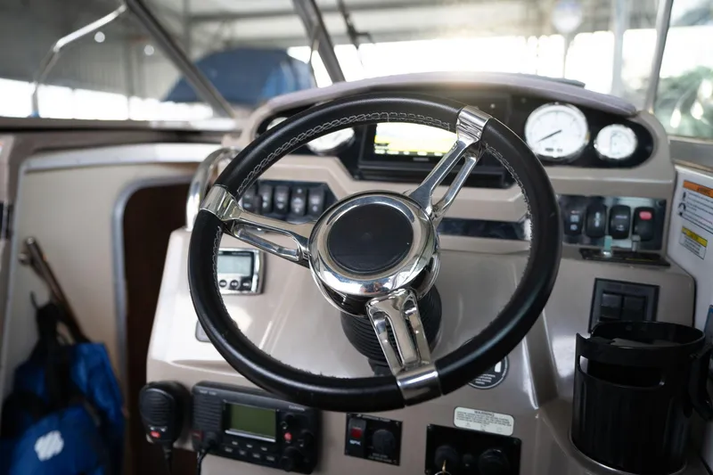 Slide: The Image of Steering wheel and dashboard of 2016 Regal 28 Express boat. - 33