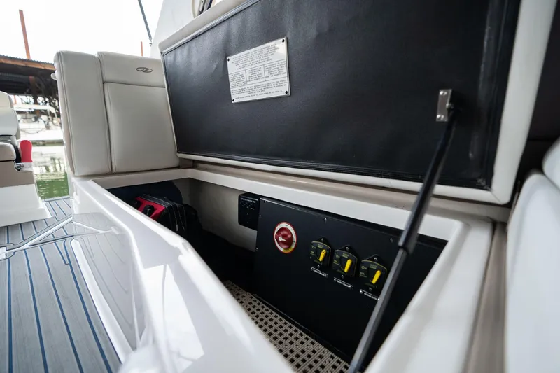 Slide: The Image of 2016 Regal 28 Express boat interior showing control panel and seating area. - 35