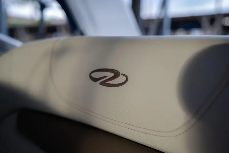 Slide: The Image of Close-up of 2016 Regal 28 Express boat seat with logo. - 38