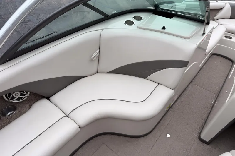 Slide: The Image of 2008 Moomba Mobius LSV boat interior with gray seating and cup holders. - 10
