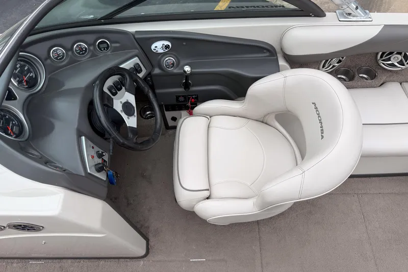 Slide: The Image of 2008 Moomba Mobius LSV boat interior with steering wheel and dashboard controls. - 11