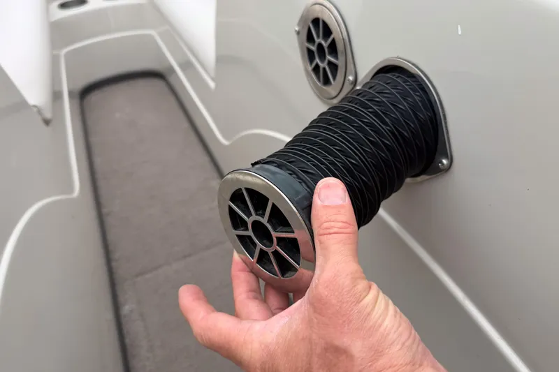 Slide: The Image of Hand adjusting vent on 2008 Moomba Mobius LSV boat interior. - 18
