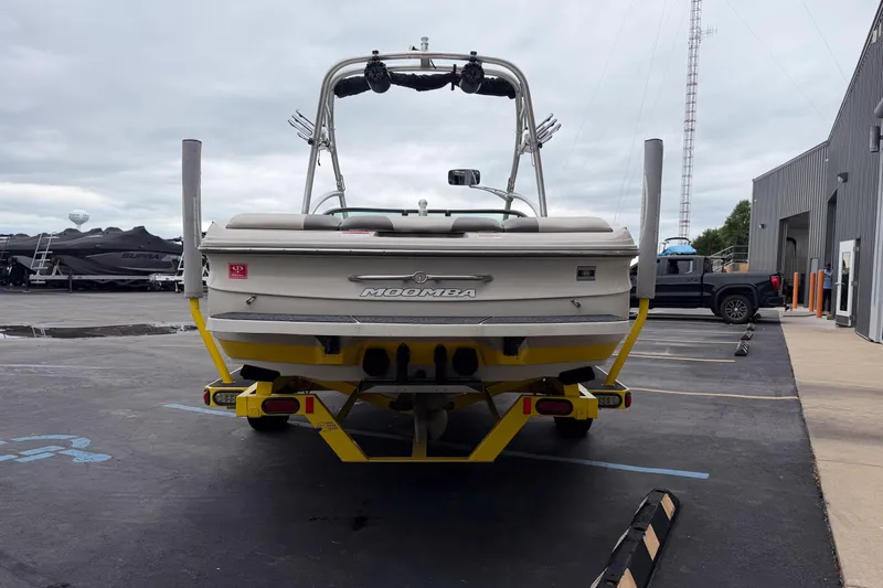 Slide: The Image of 2008 Moomba Mobius LSV boat on trailer in parking lot, rear view. - 5