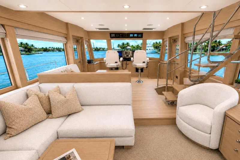 Slide: The Image of Luxurious interior of 2027 Offshore Yachts 70 CE, featuring elegant seating and panoramic windows. - 14