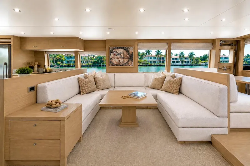 Slide: The Image of Luxurious interior of 2027 Offshore Yachts 70 CE with elegant seating and scenic views. - 15