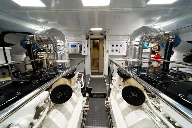 Slide: The Image of Engine room of 2027 Offshore Yachts 70 CE, featuring advanced machinery and sleek design. - 23
