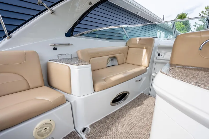 Slide: The Image of Interior of 2015 Crownline 294 CR boat with beige seating and modern design. - 14