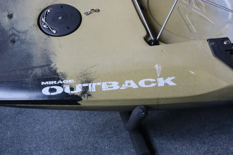 Slide: The Image of 2023 Hobie Mirage Outback kayak, olive color, with visible logo and fittings. - 2