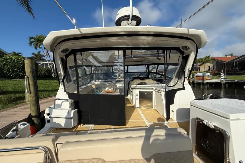 Slide: The Image of Aquila 36 Sport 2019 boat docked, featuring spacious deck and modern amenities. - 15