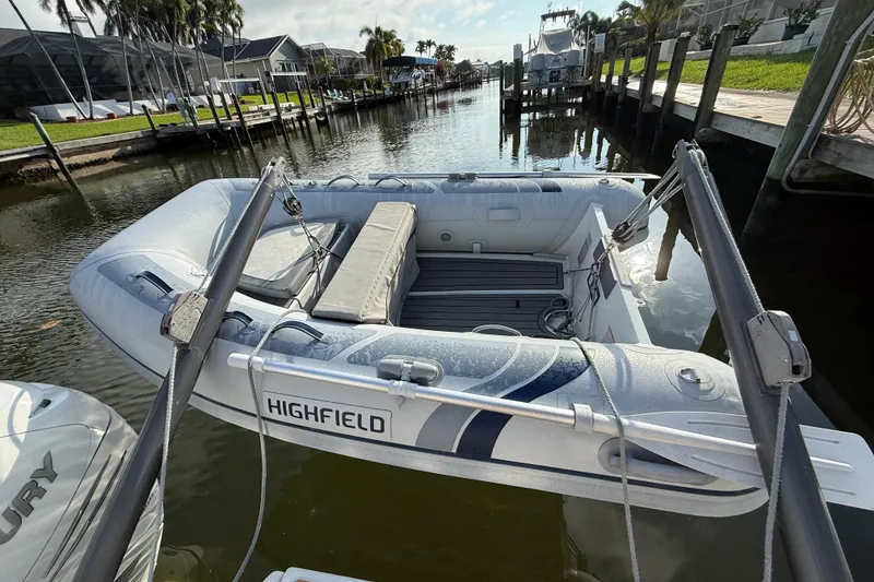 Slide: The Image of Aquila 36 Sport 2019 docked with inflatable Highfield boat in sunny marina. - 21