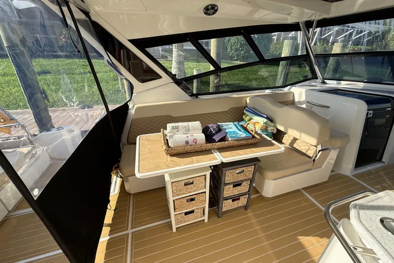 Slide: The Image of Interior of 2019 Aquila 36 Sport boat with seating and storage drawers. - 23