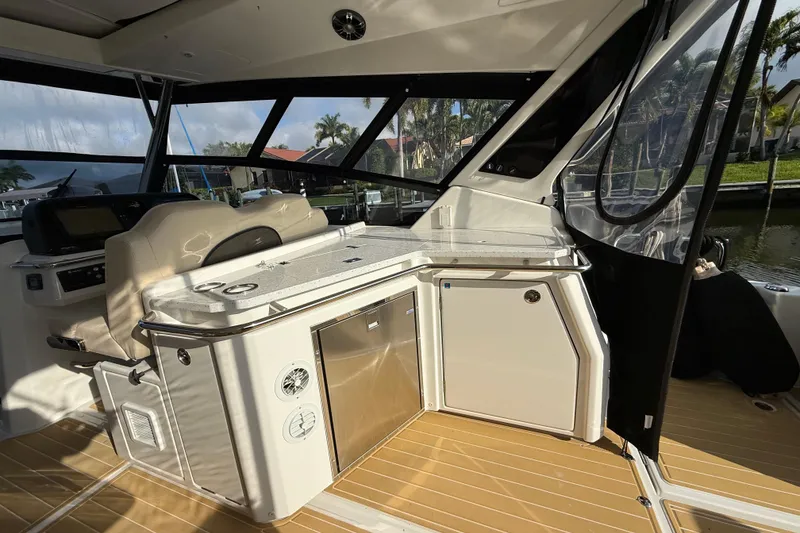 Slide: The Image of Interior of 2019 Aquila 36 Sport boat with modern helm and seating area. - 25