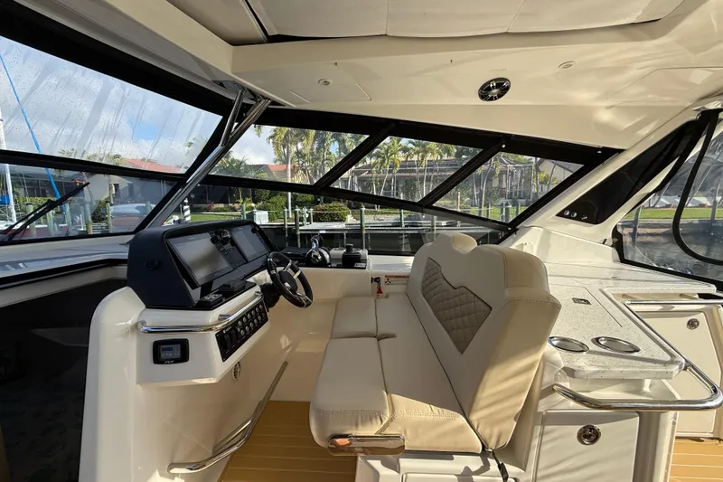 Slide: The Image of Interior of 2019 Aquila 36 Sport boat with modern helm and seating. - 28